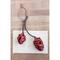 Hello Honey® 15" Metal Pinecones on Branch Wall Hanging, Brown & Red